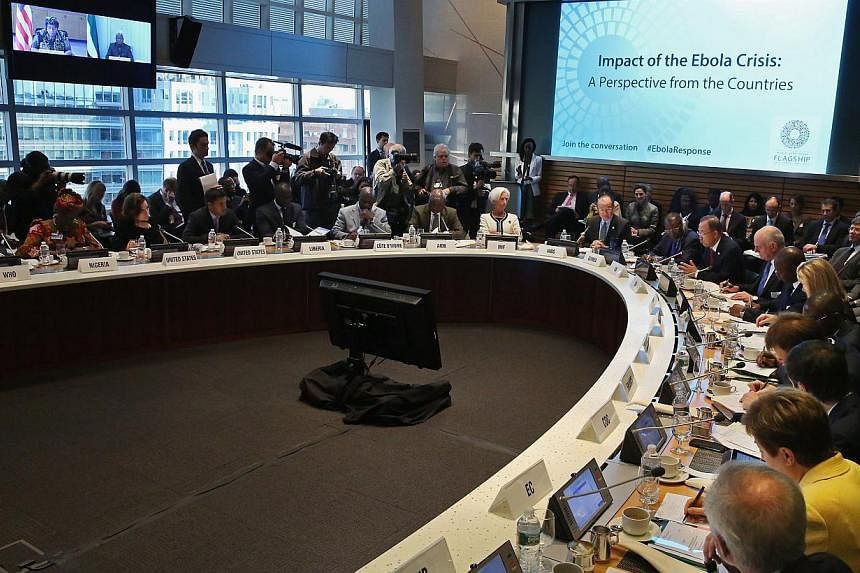 Finance ministers and representatives from around the world attend a meeting on the Ebola crisis during the International Monetary Fund-World Bank Group annual meetings on Oct 9, 2014 in Washington, DC. -- PHOTO: AFP