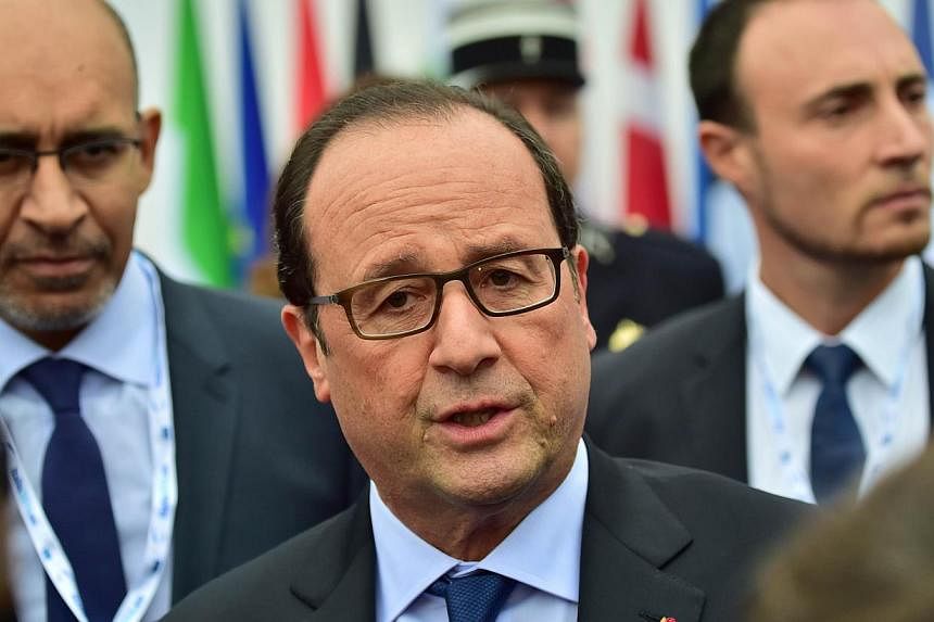 French President Francois Hollande arrives to attend an European Union extraordinary summit "Growth and Employment" on October 8, 2014 in Milan.&nbsp;France on Wednesday stepped up its fight for a relaxation of the budget rules for members of the eur