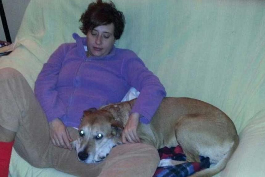 Teresa Romero Ramos, the Spanish nurse who contracted Ebola, is pictured with her dog Excalibur in this undated handout photo provided on Oct 8, 2014. Madrid regional authorities said they would euthanise the nurse's dog Excalibur to avoid possible c