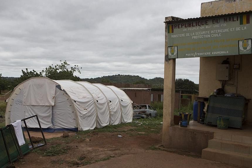 An isolation tent for people suspected to have Ebola is seen at the border with Guinea in Kouremale, on Oct 2, 2014. Singapore-based commodities trader Olam International has restricted its staff from travelling to parts of West Africa - Guinea, Libe