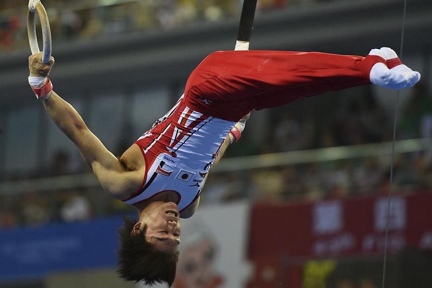 Japan's gymnast Kohei Uchimura performs on the ring during the men's all-around final at the Gymnastics World Championships in Nanning on Oct 9, 2014.&nbsp;Japan's Kohei Uchimura promised not to halt his relentless quest for perfection, despite seali
