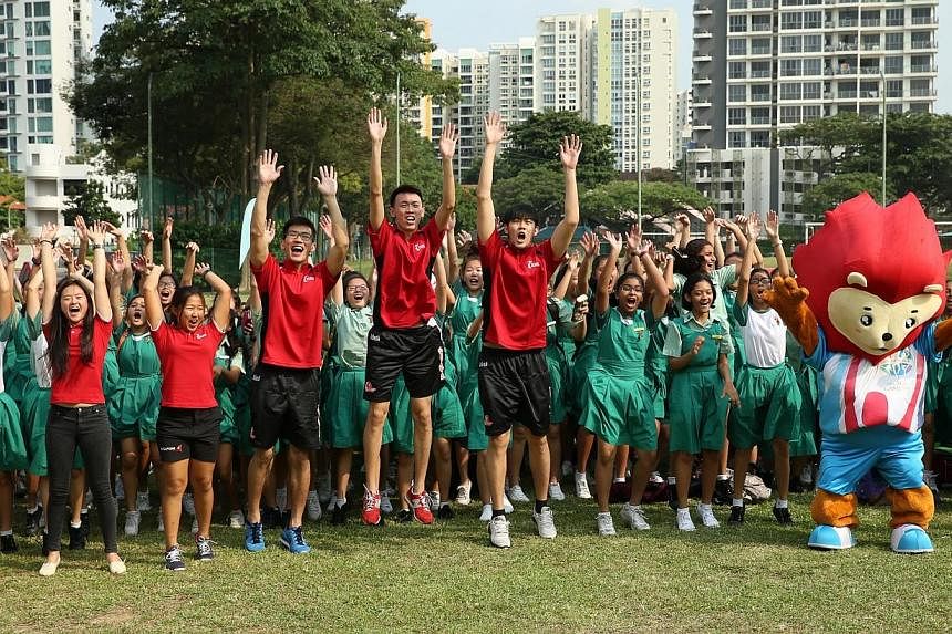 Newly-minted Asian Games gold medalists Savannah Siew (left) and Kimberly Lim (second from left) return to Tanjong Katong Girls' School to share their inspiring stories of heartbreak and triumph in sport with students of Tanjong Katong Girls' School 