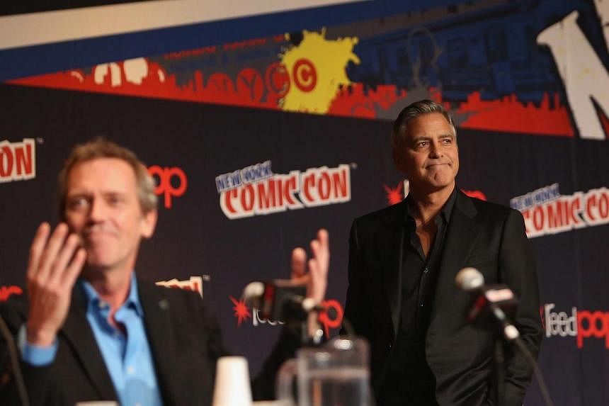 Actors Hugh Laurie (left) and George Clooney attend Walt Disney Studios' 2014 New York Comic Con presentation of Tomorrowland at the Javits Convention Center on Thursday on Oct 9, 2014, in New York City. Laurie and Clooney are co-stars in Tomorrowlan