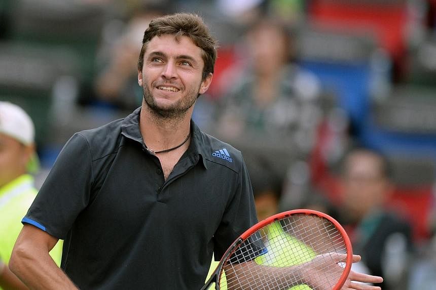 Gilles Simon of France reacts after defeating Tomas Berdych of Czech Republic during their quarter finals men's singles match at the Shanghai Masters 1000 tennis tournament held in the Qizhong Tennis Stadium in Shanghai on Oct 10, 2014.&nbsp;Unseeded