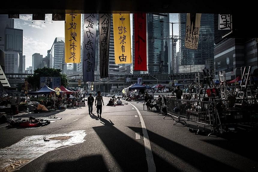 Pro-democracy demonstrators on a highway where the main protest site is located in Hong Kong on Oct 10, 2014.&nbsp;&nbsp;Hong Kong protesters planned a fresh show of force with a major rally on Friday as they won powerful new US backing in their camp