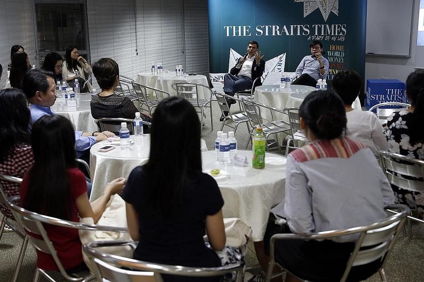 Straits Times editor Warren Fernandez (left, facing the audience) and ST Forum editor Jack Hee interacting with participants yesterday at the first Straits Times Young Forum Writers’ Gathering. The free session aims to encourage those below the age