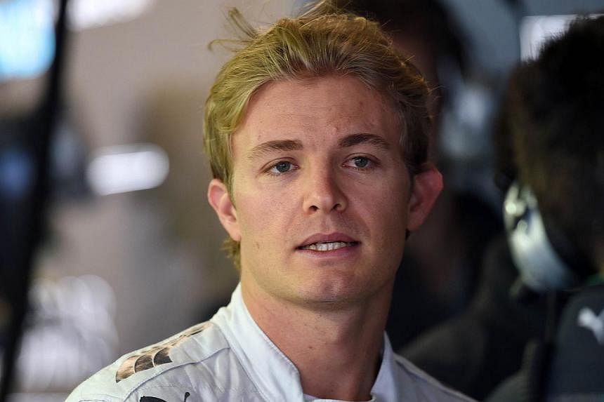 Mercedes-AMG's German driver Nico Rosberg waits in the pit area during the first practice session of the inaugural Russian Formula One Grand Prix at the F1 Autodrome in Sochi on Oct 10, 2014. -- PHOTO: AFP