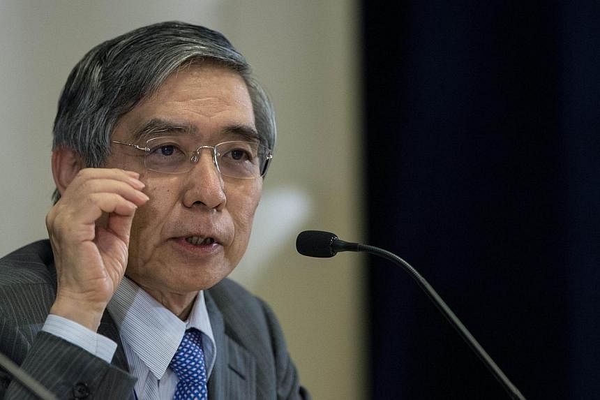Mr Haruhiko Kuroda, Governor of the Bank of Japan, addresses a press conference during the IMF/World Bank annual meetings in Washington on Oct 10, 2014. Mr Kuroda said there was no gap in views between the government and the central bank that a weak 