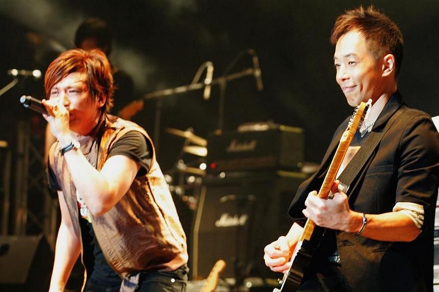 Yip Sai Wing (left) and Paul Wong of former Hong Kong band Beyond performing at the Singapore Indoor Stadium. -- PHOTO: LIANHE ZAOBAO FILE&nbsp;