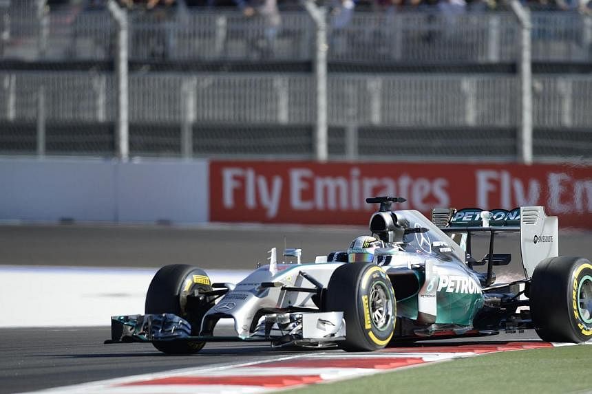 Mercedes' British driver Lewis Hamilton drives during the qualifying session of the inaugural Russian Grand Prix at the Sochi Autodrom in Sochi on Oct 11, 2014. -- PHOTO: AFP