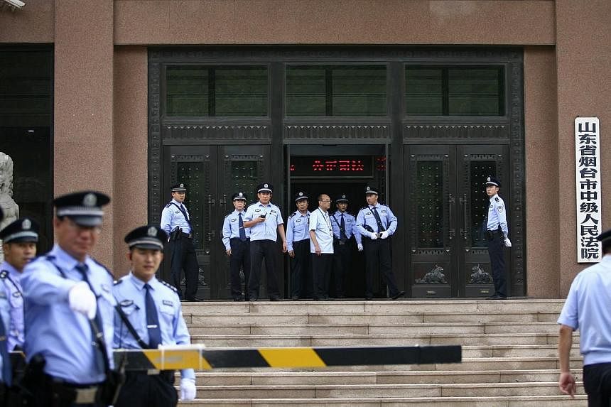 China sentenced two members of a banned religious cult to death on Saturday for the murder of a woman at a McDonald's restaurant after she refused an apparent attempt by the group to recruit her, state media said. -- PHOTO: REUTERS