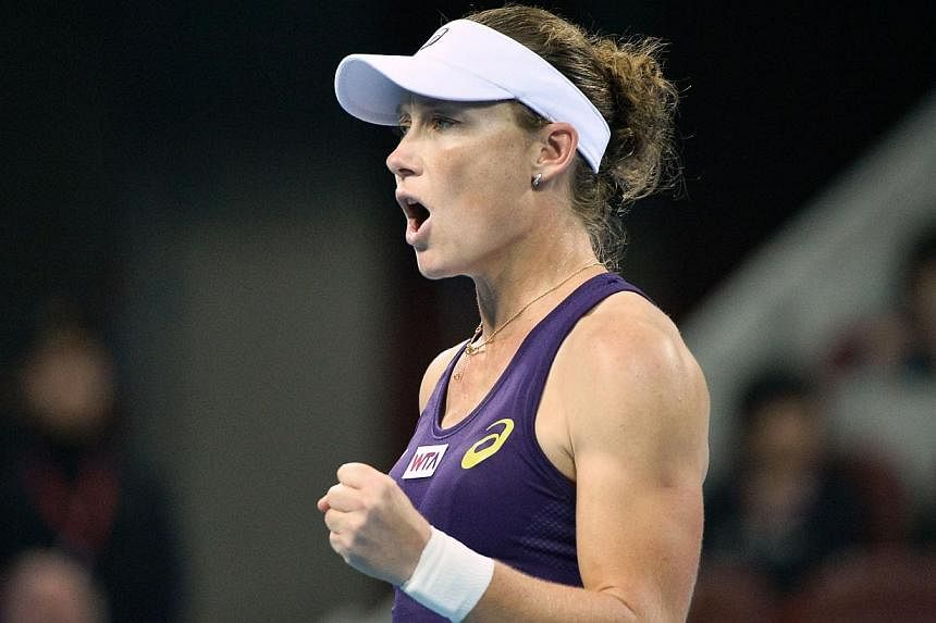 Samantha Stosur of Australia reacts after a point against Petra Kvitova of the Czech Republic during their women's singles semi-final match at the China Open tennis tournament in the National Tennis Center of Beijing on Oct 4, 2014. &nbsp;-- PHOTO: A