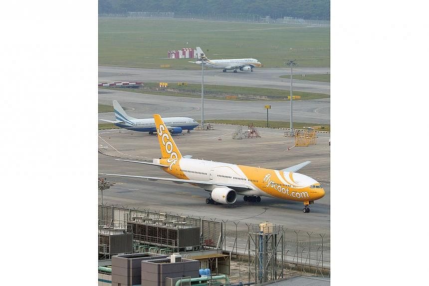 Hundreds of passengers were stranded for at least two hours at Changi Airport, after a glitch knocked out budget airline Scoot's electronic check-in system for six hours on Friday night. -- ST PHOTO:&nbsp;ASHLEIGH SIM