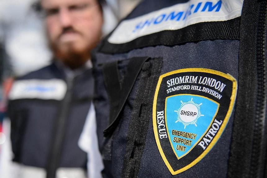 Members of the Jewish "Shomrim" security patrol team are pictured in north London on August 27, 2014. -- PHOTO: AFP