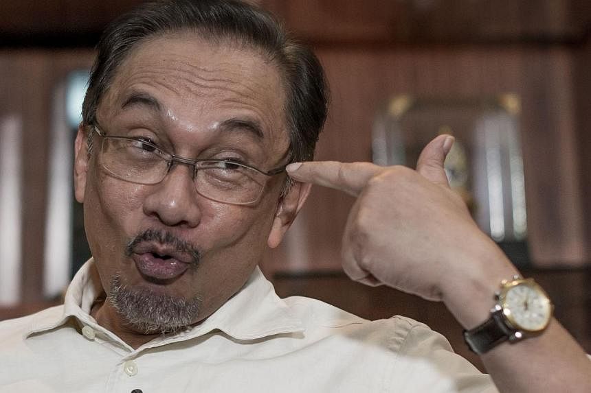 Malaysian opposition leader Anwar Ibrahim speaks during an interview with Agence France Presse at his office in Kuala Lumpur on Sept 30, 2014.&nbsp;Mr Anwar says "he's prepared for the worst" as he stares at the prospect of imprisonment once again on