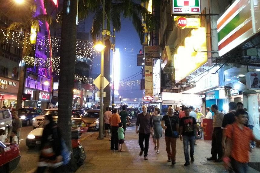 Police have raided six nightclubs in Bukit Bintang as the hunt for "Ah Hai", the suspected target in the grenade attack at Sun Complex on Oct 9, 2014, continues. -- ST PHOTO:&nbsp;TEO CHENG WEE