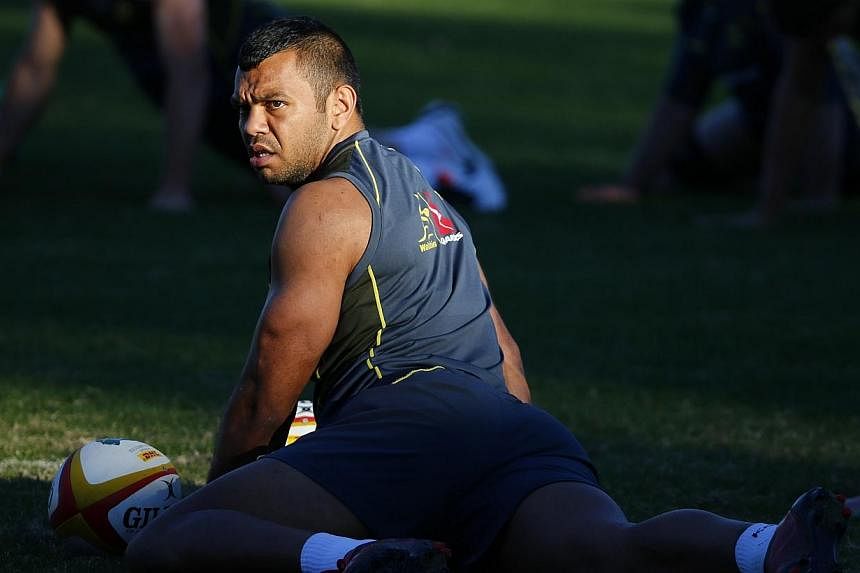 Australian rugby team player Kurtley Beale stretches during a training session in Sydney in this file picture taken on July 2, 2013.&nbsp;Wallabies captain Michael Hooper said on Sunday that Kurtley Beale should not be sacked and has called for a squ