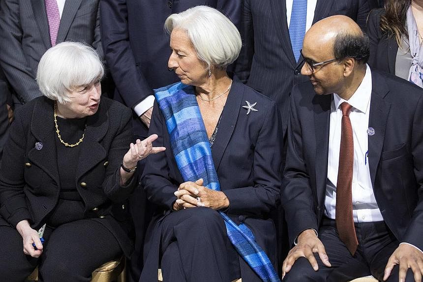 Deputy Prime Minister Tharman Shanmugaratnam - seen here (above) with US Federal Reserve chair Janet Yellen (left) and International Monetary Fund managing director Christine Lagarde - warned that a&nbsp;global economy still recovering from the finan