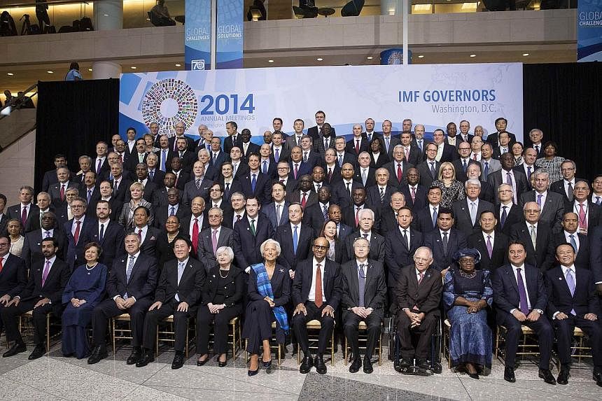 Members of the International Monetary and Financial Committee (IMFC) pose for a family portrait during the World Bank/IMF annual meetings in Washington Oct 11, 2014. -- PHOTO: REUTERS