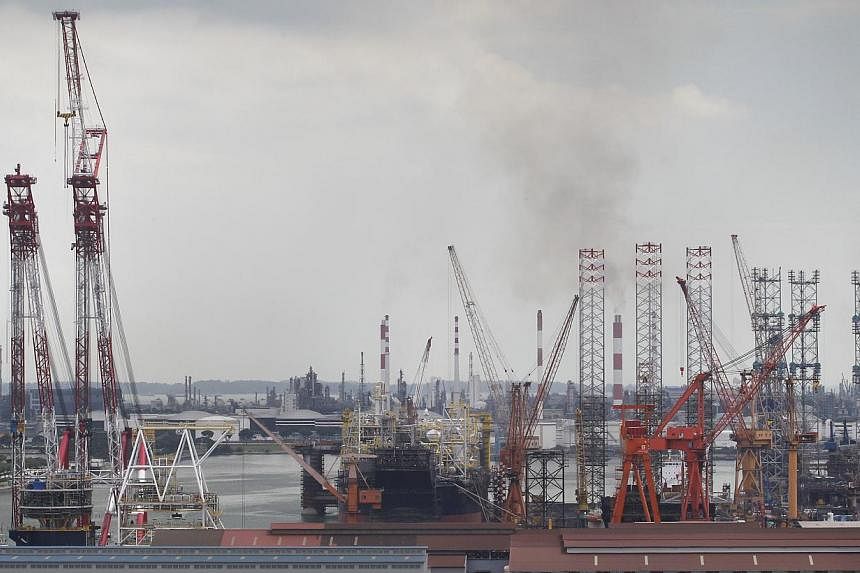 Oil rigs at Jurong Shipyard. -- ST PHOTO:&nbsp;KEVIN LIM