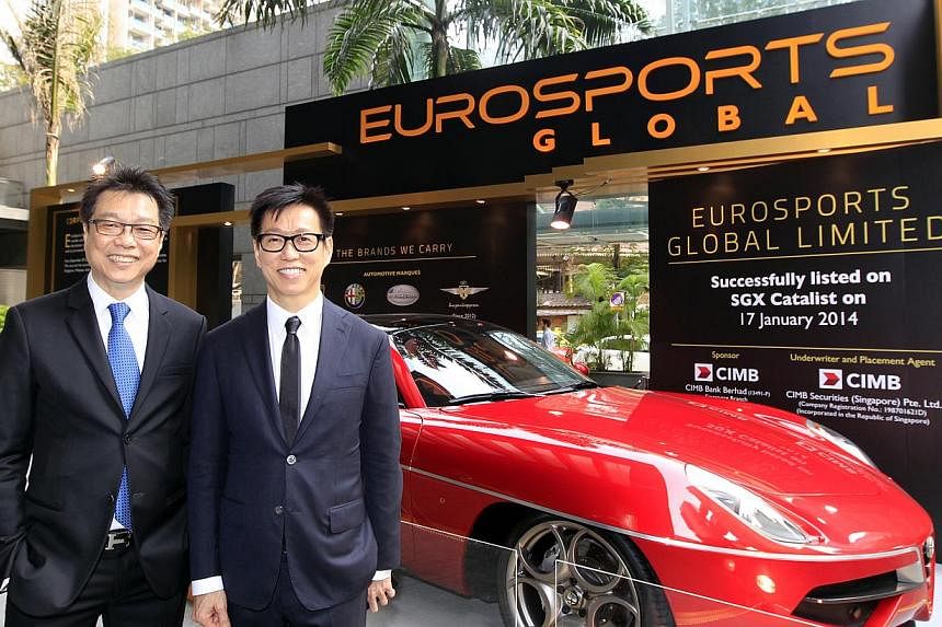 EuroSports Global executive chairman and CEO Melvin Goh (left) and executive director and deputy CEO Andy Goh at the listing ceremony held outside SGX Centre in Shenton Way on Jan 17, 2014. -- ST PHOTO FILE