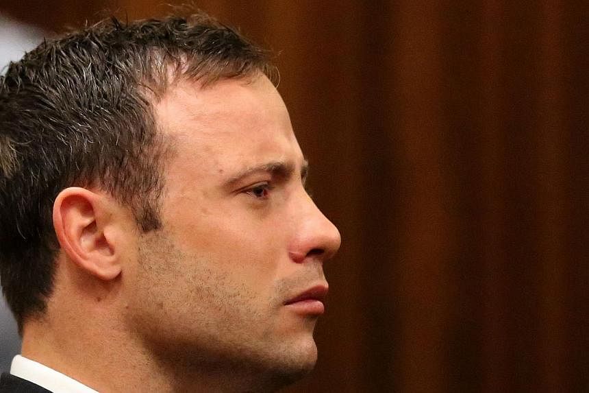 Fallen paralympic star Oscar Pistorius listens to the verdict in his trial at the high court in Pretoria on September 12 2014, in this file photo. He returns to court on Monday at the start of his sentencing hearing after he was convicted of culpable