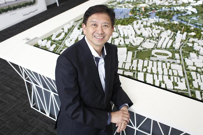 Managing partner of Evia Real Estate, Vincent Ong, 53, poses for a photograph at the Lake Life condominium showroom on Oct 3, 2014.&nbsp;Plans to jazz up the Jurong Lakeside district probably caused the overwhelming response to the Lake Life executiv