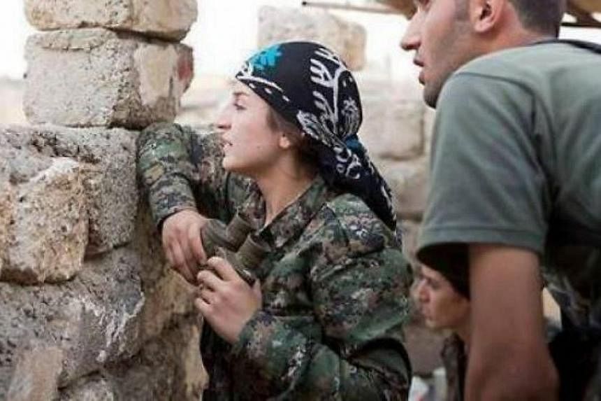 Kurdish woman commander Mayssa Abdo, 40, on the frontlines against ISIS fighters in Kobane. -- PHOTO: PRESS TV