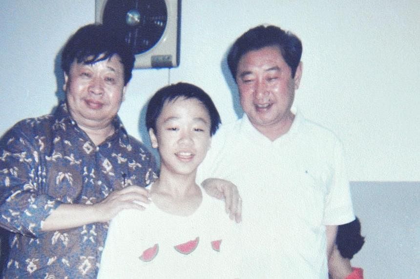 Chong as a student with the late Chinese crosstalk legend, Ma Ji (above left) and another crosstalk master, Zhao Shizhong, in 1990. -- PHOTO: COURTESY OF OLIVER CHONG