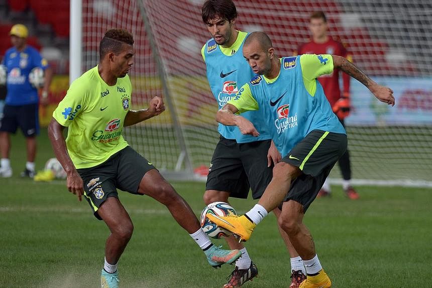 The Brazilian Team training at the National Stadium on Monday, ahead of their clash with Japan on Tuesday. Brazilian head coach Dunga has voiced his concerns about the condition of the pitch as well as the fatigue levels among his players. -- ST PHOT