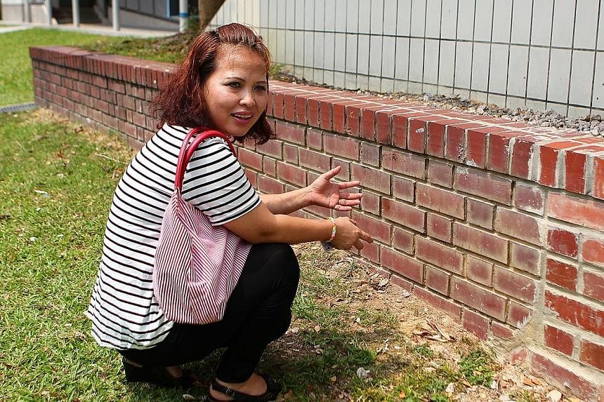 She then got Mr Tan to change into the clean shorts and asked him to sit on a nearby brick ledge, while she knelt before him and started to wipe the faeces off him.&nbsp;--&nbsp;PHOTO:&nbsp;&nbsp;THE NEW PAPER