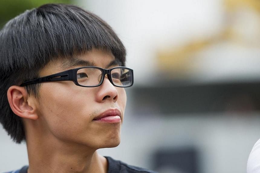 Hong Kong democracy campaigner Joshua Wong, 18, made Time's annual list of most influential teenagers. -- PHOTO: AFP
