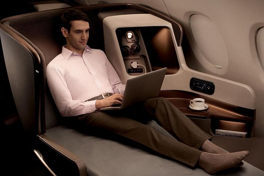 Singapore Airlines (SIA) new business class seat on Boeing 777-300 ER. The cost of business-class flights to London and New York have dropped in all cities, except Manila, where they have risen 4 per cent. -- PHOTO: SINGAPORE AIRLINES