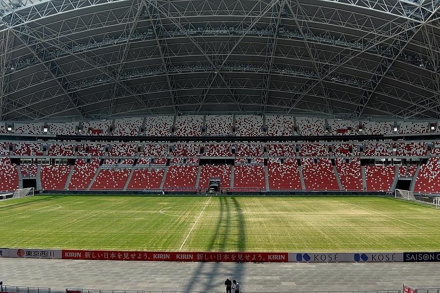 The National Stadium’s sandy pitch has sprouted a sprinkling of hilarious jokes and memes on social media, with many Twitter users using the hashtag “yourpitchissosandy” to jest at the lack of grass growing on the pitch. -- ST PHOTO:&nbsp;JAMIE