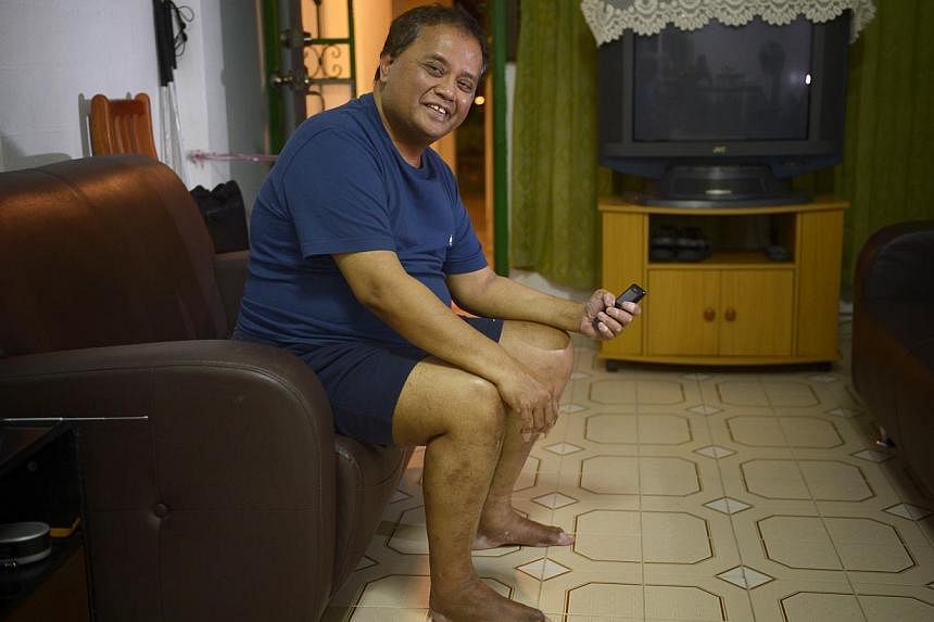 Suhaimi Mansoor, 58, is a beneficiary of StarHub's programme. -- ST PHOTO:&nbsp;MARK CHEONG