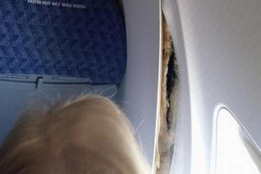 A passenger onboard American Airlines flight AA2293 posted this picture of the plane's wall panels coming loose mid-flight. -- PHOTO: JAMES WILSON'S FACEBOOK PAGE