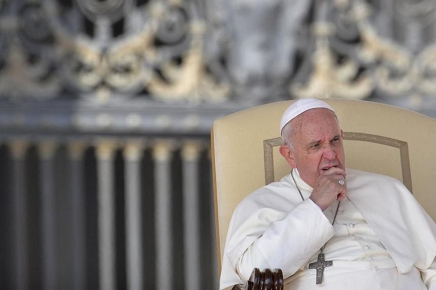 Pope Francis gives his weekly general audience at St Peter's square on Oct 8, 2014 at the Vatican. -- PHOTO: AFP