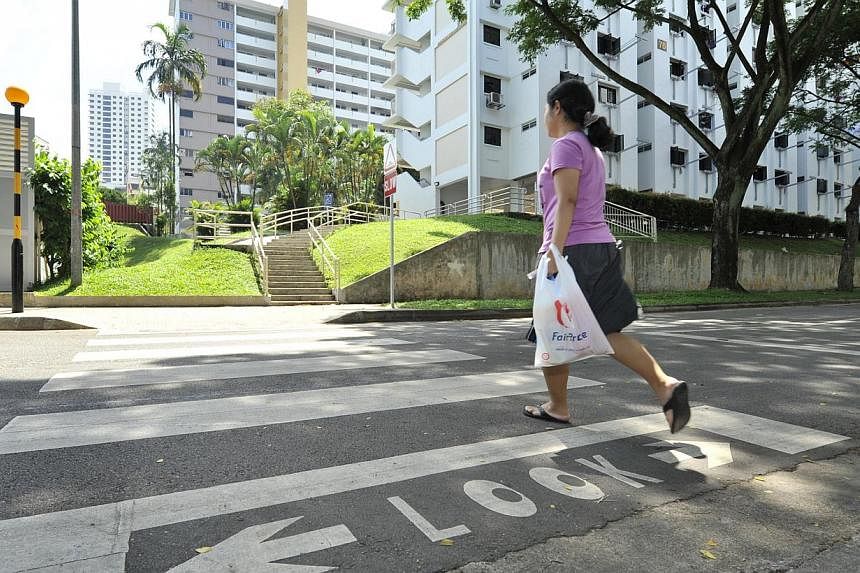 Modified road markings at Telok Blangah Street 31 to&nbsp;remind pedestrians to look out for oncoming vehicles before they cross. -- ST PHOTO:&nbsp;EDWARD TEO