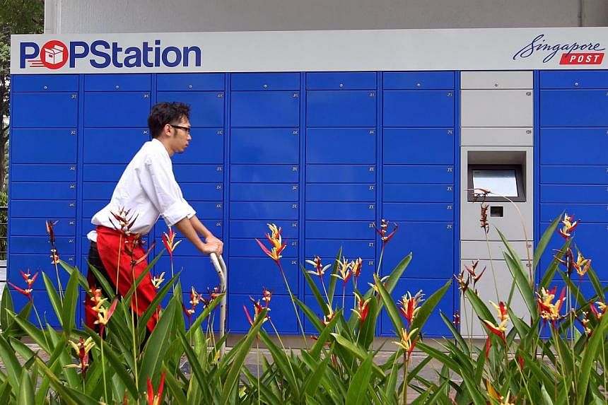 Users can now post parcels and pay for their purchases through Singapore Post's POPStations (Pick Own Parcel Station). -- PHOTO: ST FILE