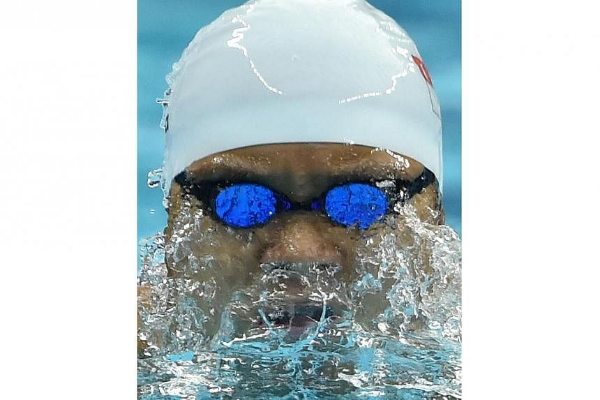 Singapore's Pang Sheng Jun competes in the heats of the men's 200m individual medley swimming event during the 17th Asian Games at the Munhak Park Tae-hwan Aquatics Centre in Incheon on Sept 22, 2014. -- PHOTO: AFP