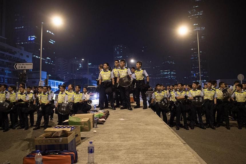 Police prepare to confront pro-democracy protesters outside the central government offices in the Admiralty district of Hong Kong on Oct 15, 2014.&nbsp;China sees no need "so far" for its army to be deployed in Hong Kong to contain democracy protests