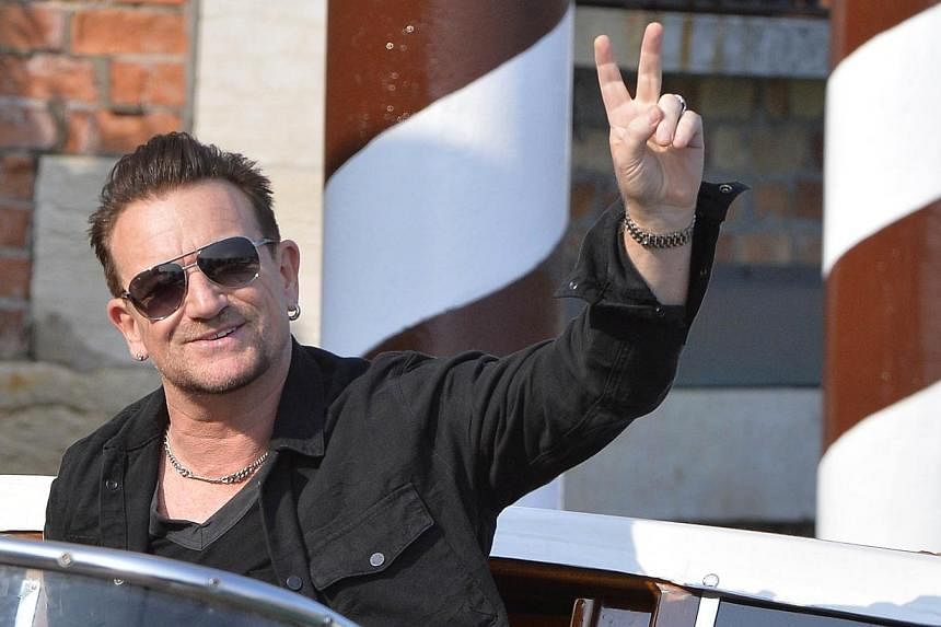 Irish singer and frontman of U2, Bono, arriving at the Cipriani Hotel in Venice for the wedding of US actor george Clooney with British Amal Alamuddin in Venice on&nbsp;Sept 27, 2014.&nbsp;Bono is sorry for giving away U2's latest album for free on i