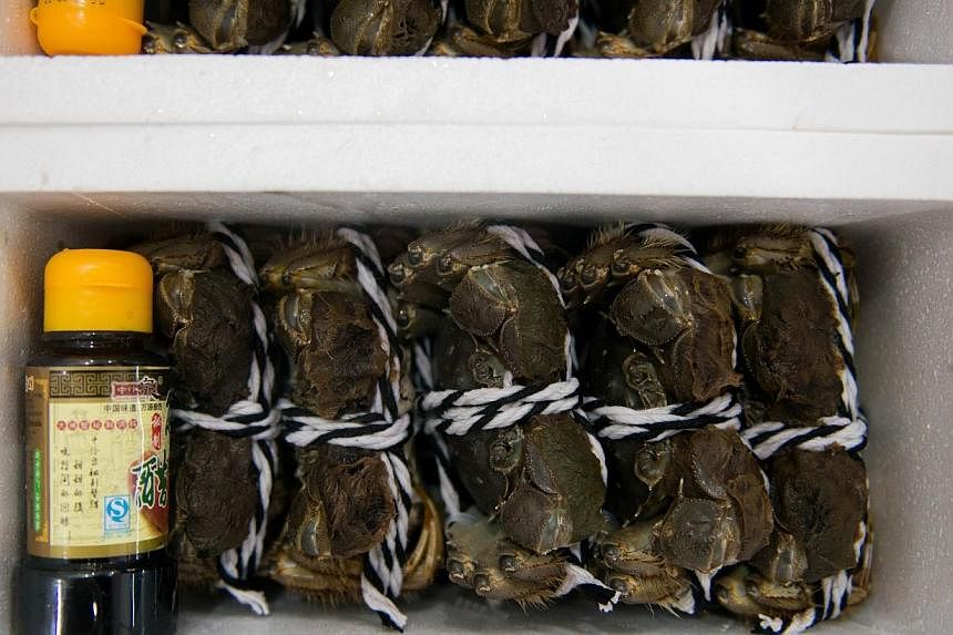 Hairy crabs packed to sell at an aquatic product market in Shanghai&nbsp;on Oct 14, 2014.&nbsp;China's gourmet crab industry has become the latest victim of Communist authorities' two-year corruption crackdown after high-end spirits and luxury cars, 