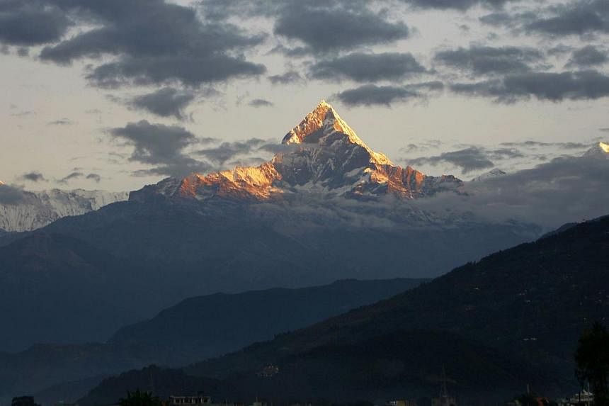 Mount Machhapuchhre, which stands at 6993 metres and forms part of the Annapurna region, is seen from Pokhara, some 200kms west of the Nepalese capital Kathmandu on Nov 1, 2010.&nbsp;Nine trekkers – eight foreigners and a local man – have been ki