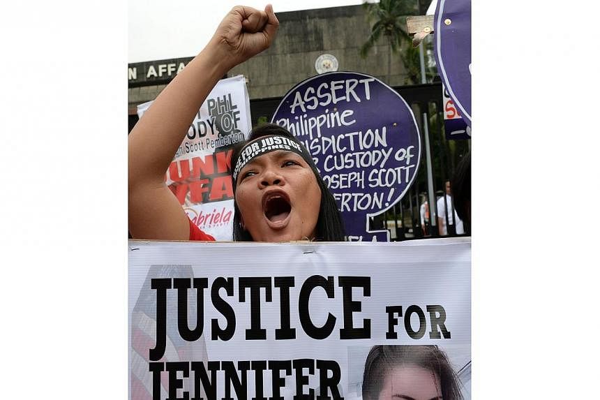 A protester shouts slogans during a rally to condemn the murder of a local transgender person in front of the foreign affairs office in Manila on Oct 15, 2014.&nbsp;The family of Mr Jeffrey "Jennifer" Laude filed a murder case on Wednesday afternoon 