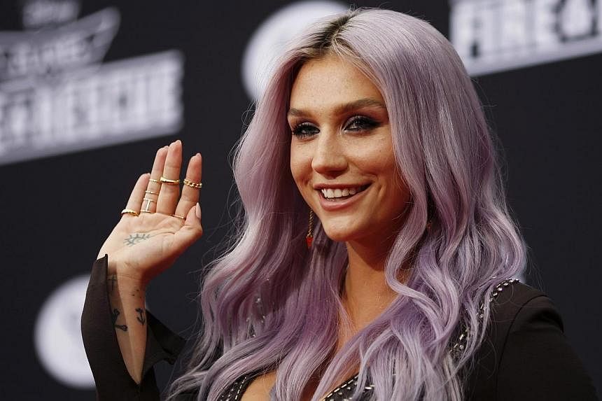 Recording artists Kesha arrives to the premiere of Planes: Fire &amp; Rescue at the El Capitan Theater in the Hollywood section of Los Angeles, California on July 15, 2014. -- PHOTO: REUTERS