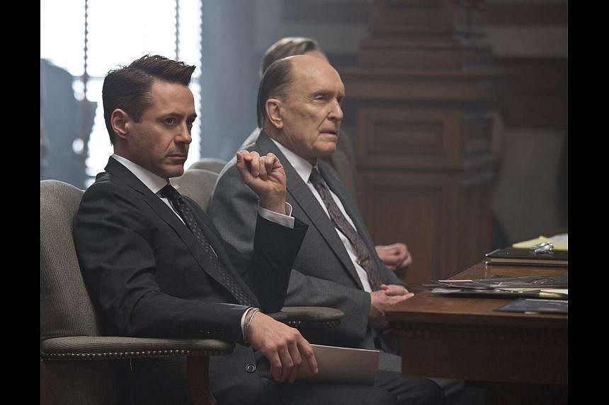 Robert Downey Jr (left) plays a Chicago lawyer who returns to his hometown to defend his father (Robert Duvall, centre) in The Judge. -- PHOTO: GOLDEN VILLAGE