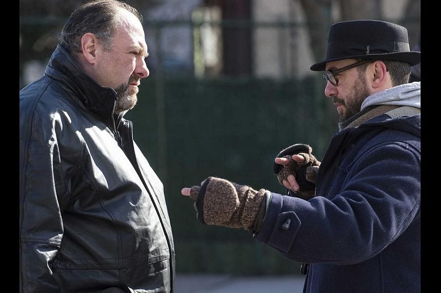 The late actor James Gandolfini (left), on set with Belgian director Michael Roskam, is perfect as bar owner Marv, in his final feature film. -- PHOTO: FOX