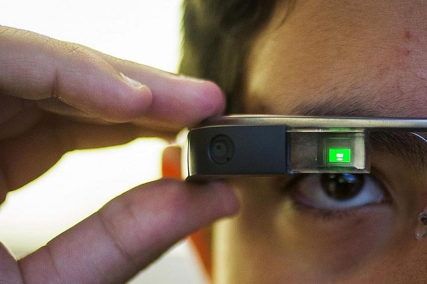 A 31-year-old American was treated for addiction after wearing Google Glass (as modelled above in New York in September 2014) for up to 18 hours a day and even experienced dreams as if looking through the device, doctors said. -- PHOTO: REUTERS