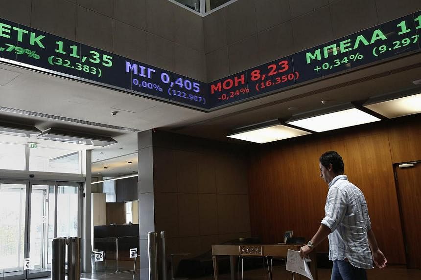 Greek bonds and stocks slumped on Wednesday as investors fretted about the political situation in the country and the government's intention to end its IMF programme early. -- PHOTO: REUTERS